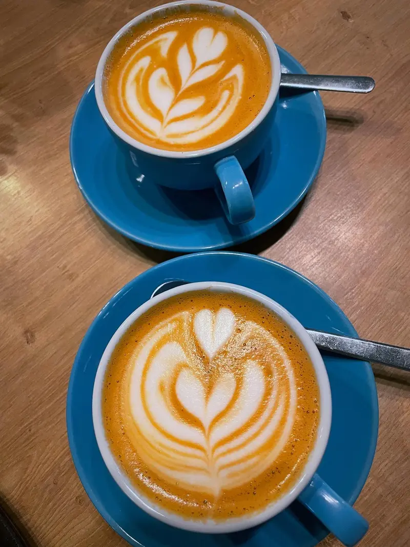 Latte art in a coffee cup at Mondo